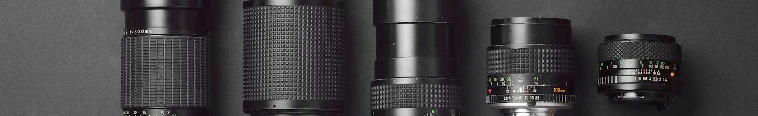Collection,Of,Camera,Lens,Well,Organized,Over,Black,Background